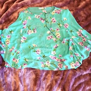 A sheer top with an included tank top for underneath.